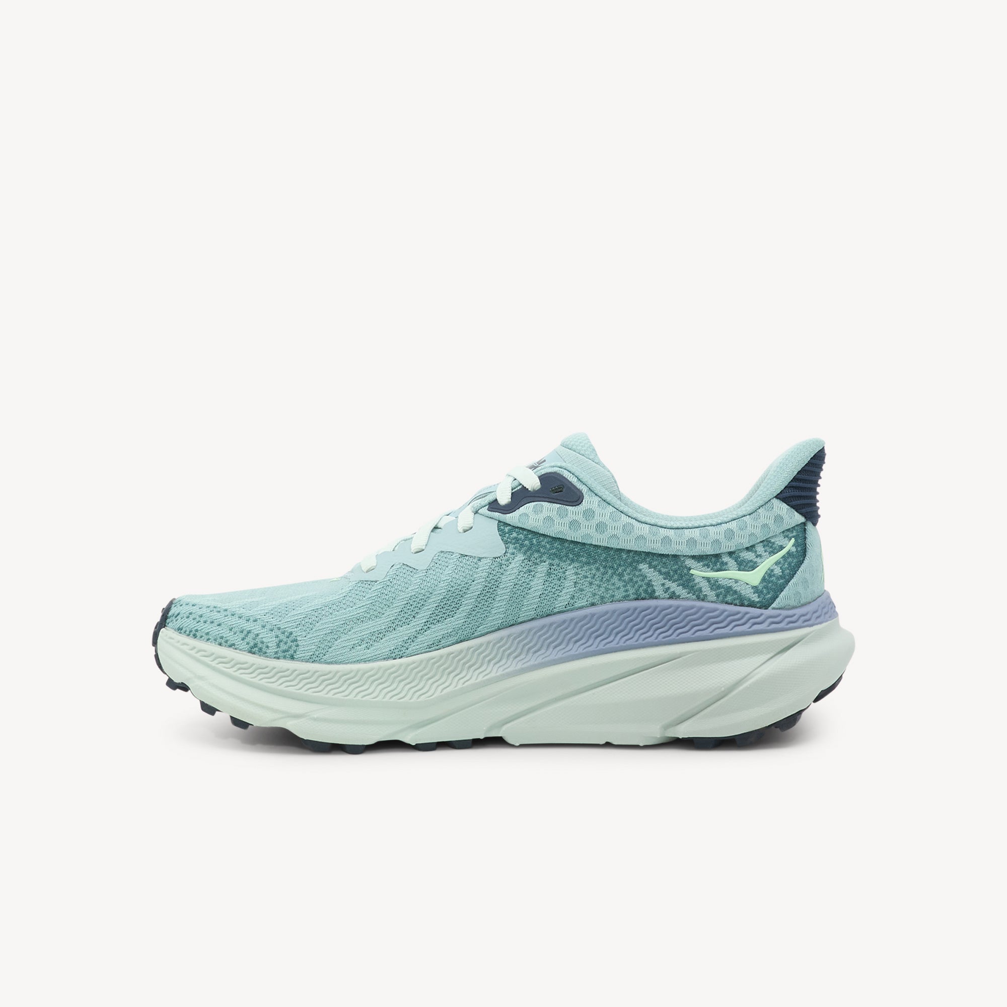Side view of HOKA Challenger ATR 7 women's showcasing enhanced stack height with compression-molded EVA midsole for all-terrain comfort