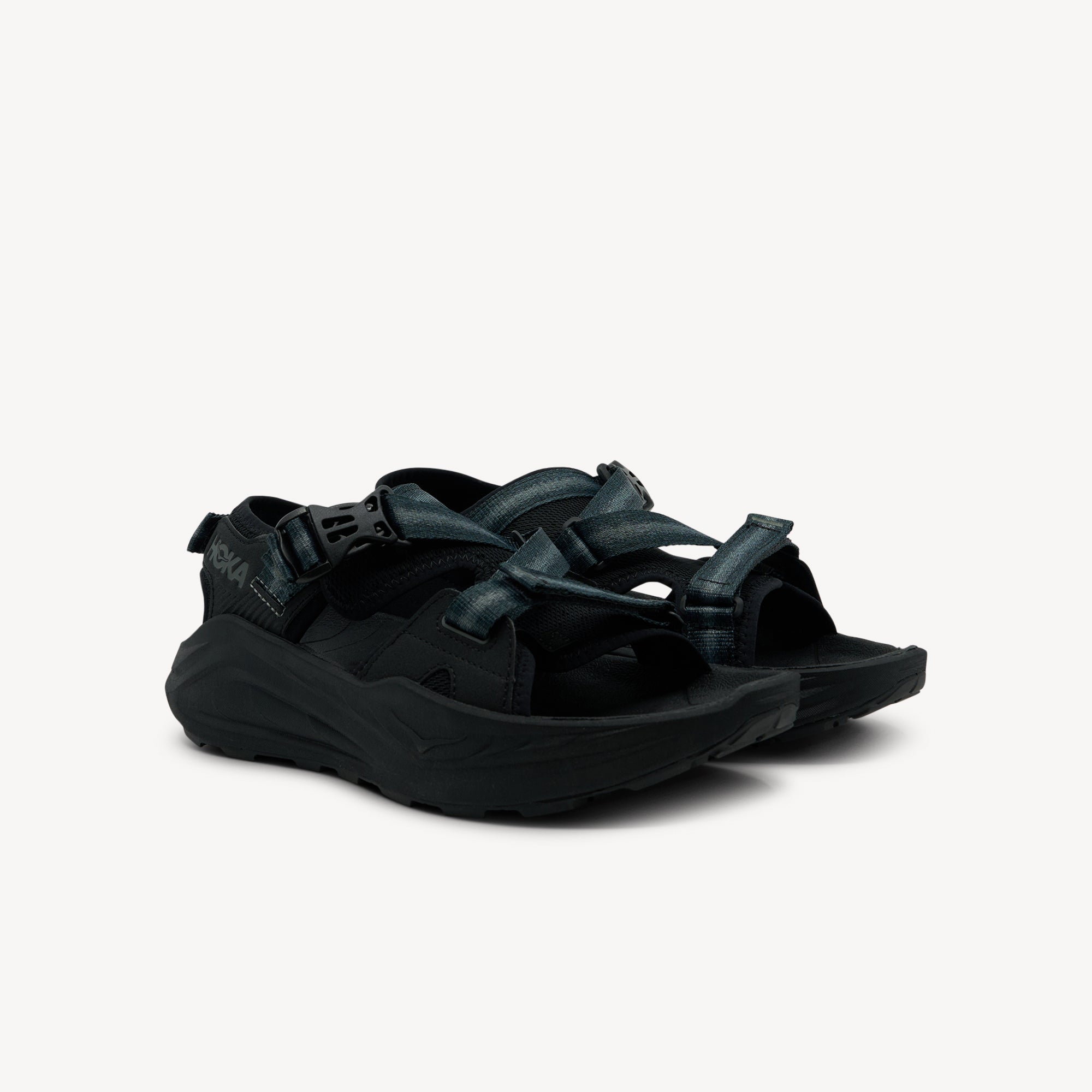 Side view of Hoka Infini Hike TC features maximalist cushioning at Profeet Footwear. Adventure sandal with deep heel cup and adjustable fit for trails. Shop now.