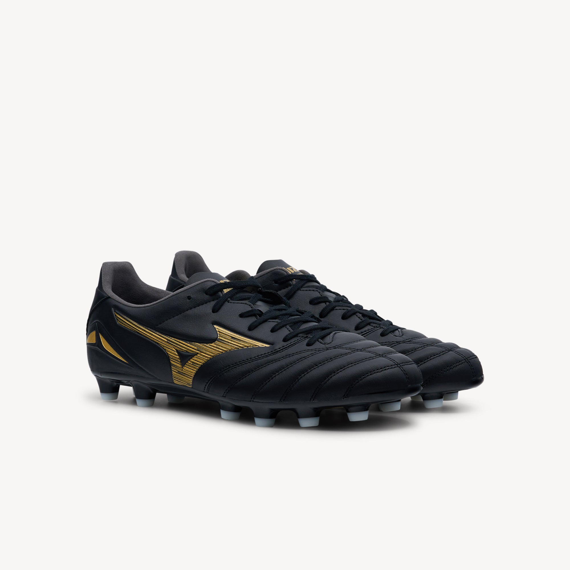 Side view of Mizuno Morelia Neo IV Pro features legendary touch at Profeet Footwear. Aurum Pack firm ground boot with K-leather forefoot for ultimate ball control.