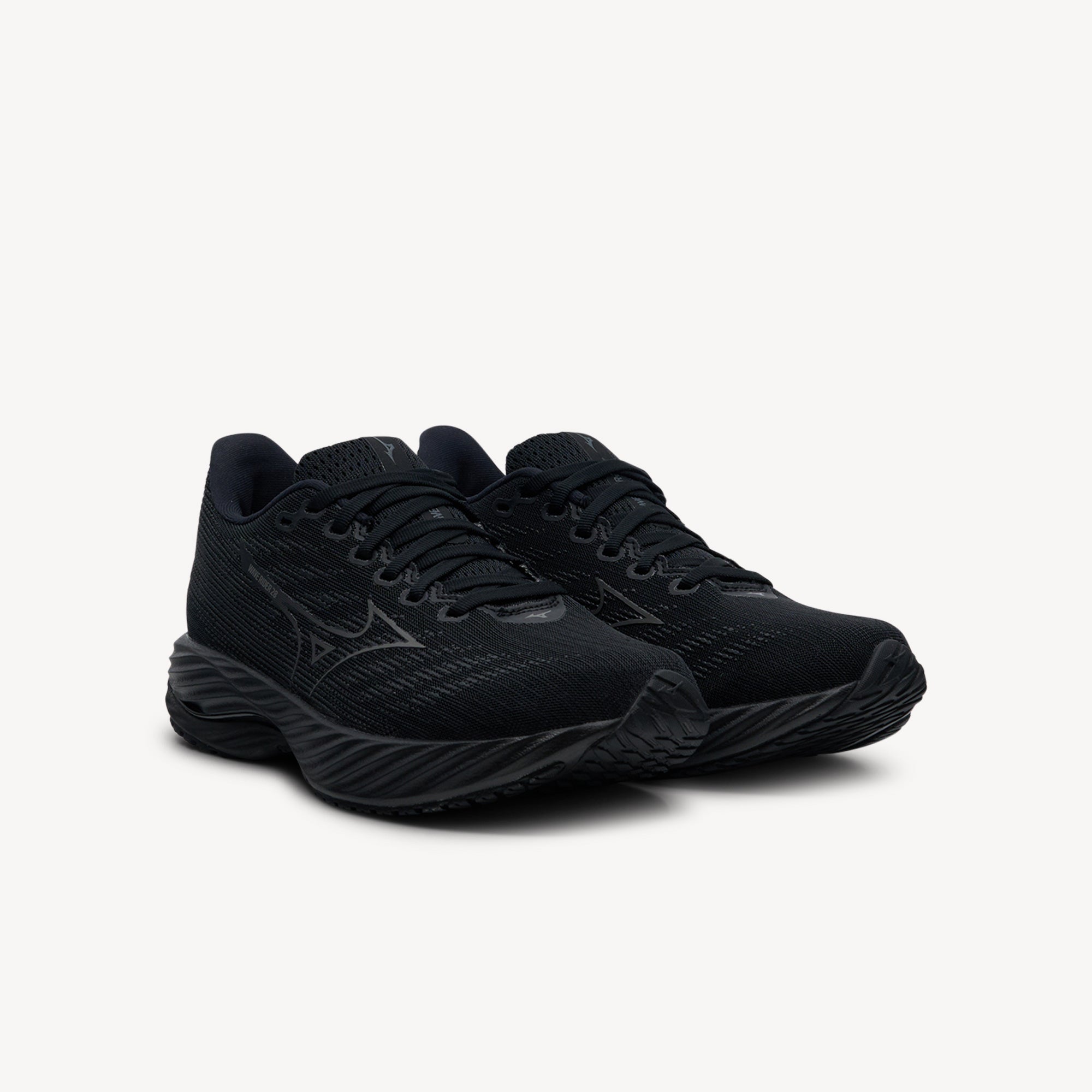 Side view of Mizuno Wave Rider 28 features bio-based Wave Plate at Profeet Footwear. Women's neutral running shoe for smooth transitions and responsive daily training runs.