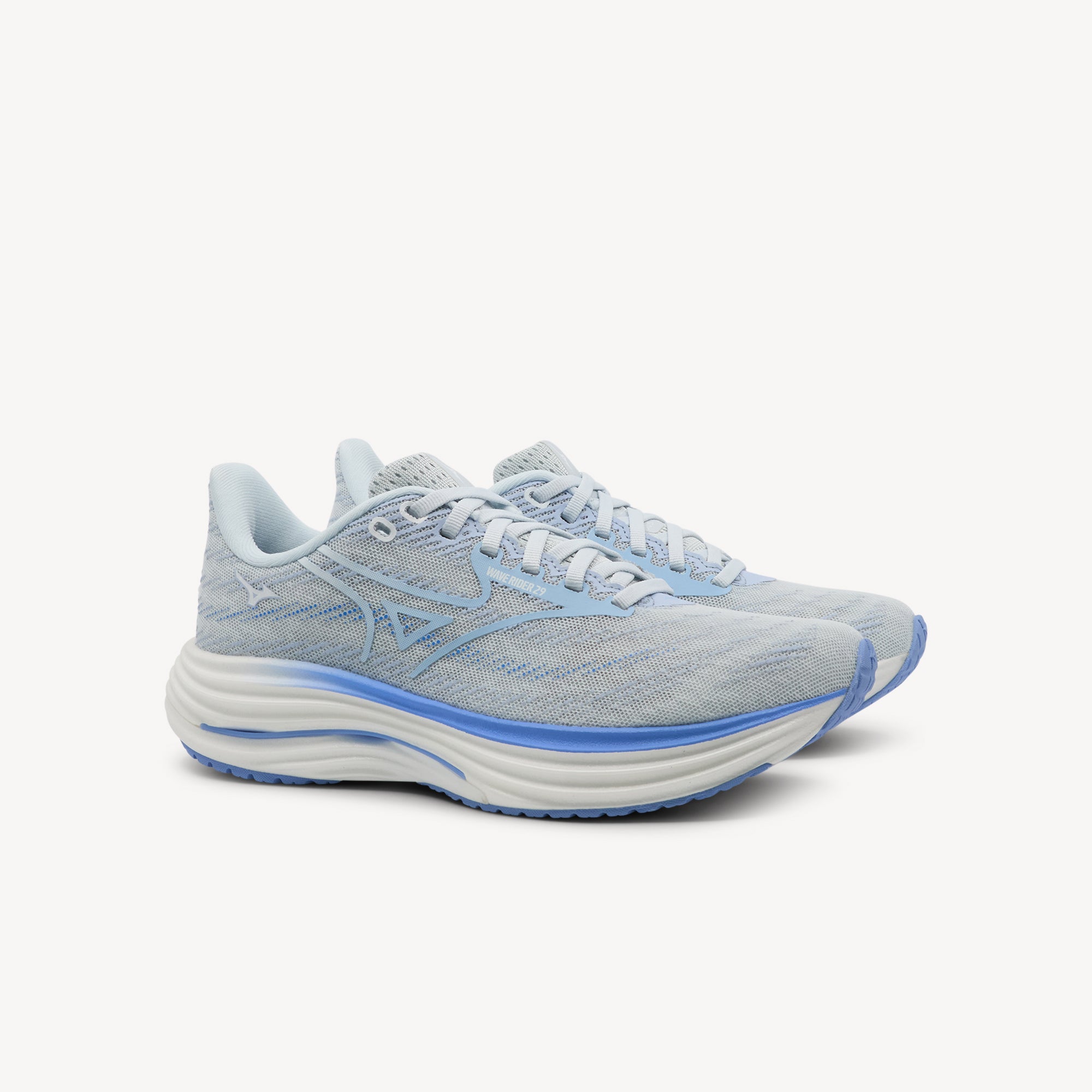 Side view of MIZUNO WAVE RIDER 29 features smooth cushioning and responsive performance at Profeet Footwear. Purpose-built running shoe for women. Expert-fitted.
