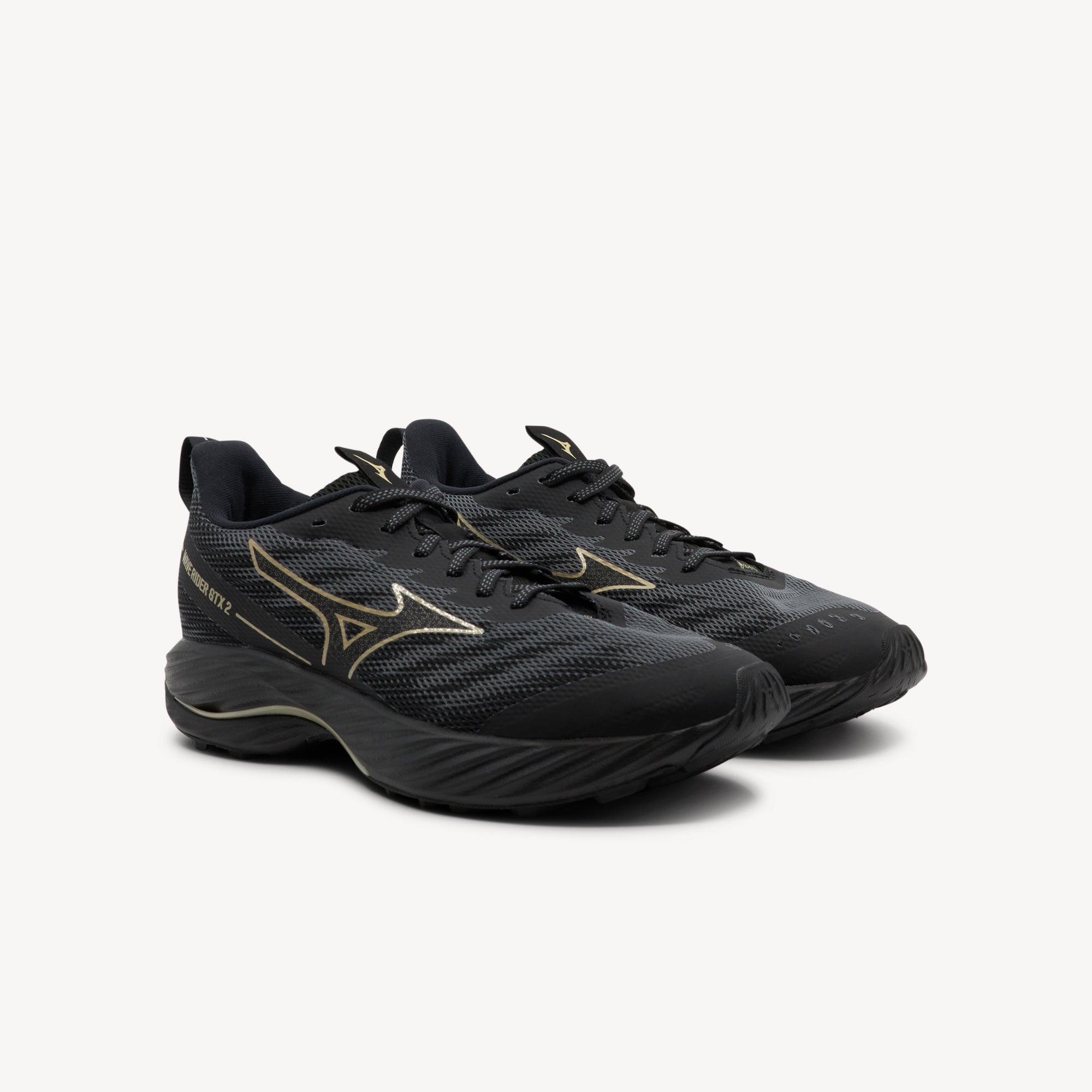 Side view of Mizuno Wave Rider GTX 2 features Gore-Tex technology at Profeet Footwear. Women's waterproof shoe for all-weather running with ENERZY NXT cushioning.