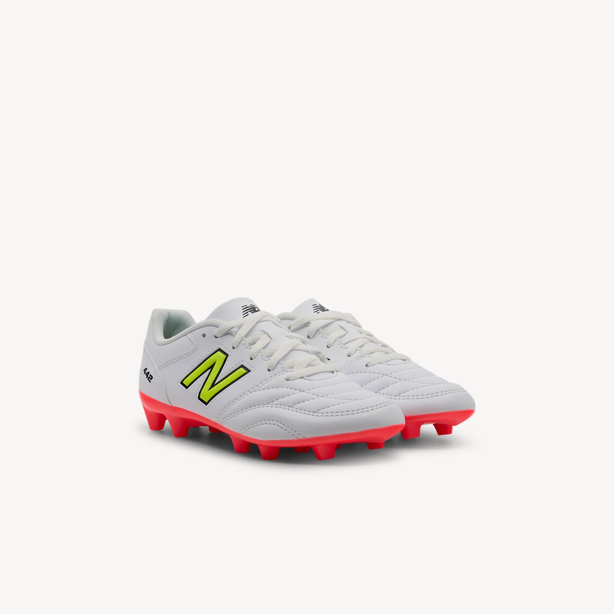 Side view of New Balance 442 v2 Academy Jnr features classic design and reliable fit at Profeet Footwear. Quality kids' football boot for grassroots. Shop now.