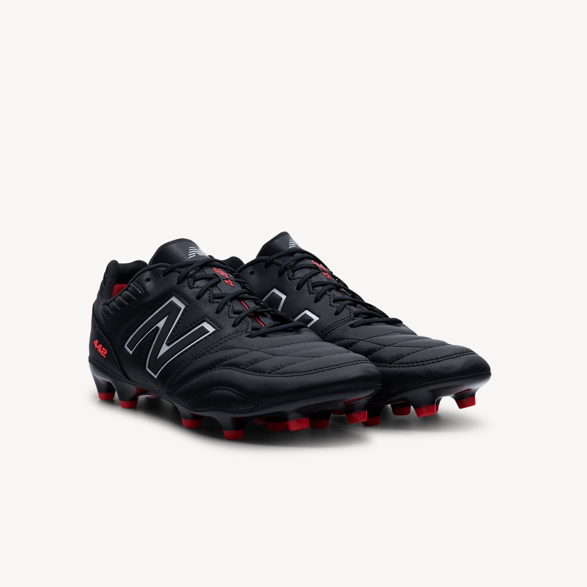 Side view of New Balance 442 Pro v2 features kangaroo leather and classic design at Profeet Footwear. Traditional football boot for players seeking quality. Shop now.