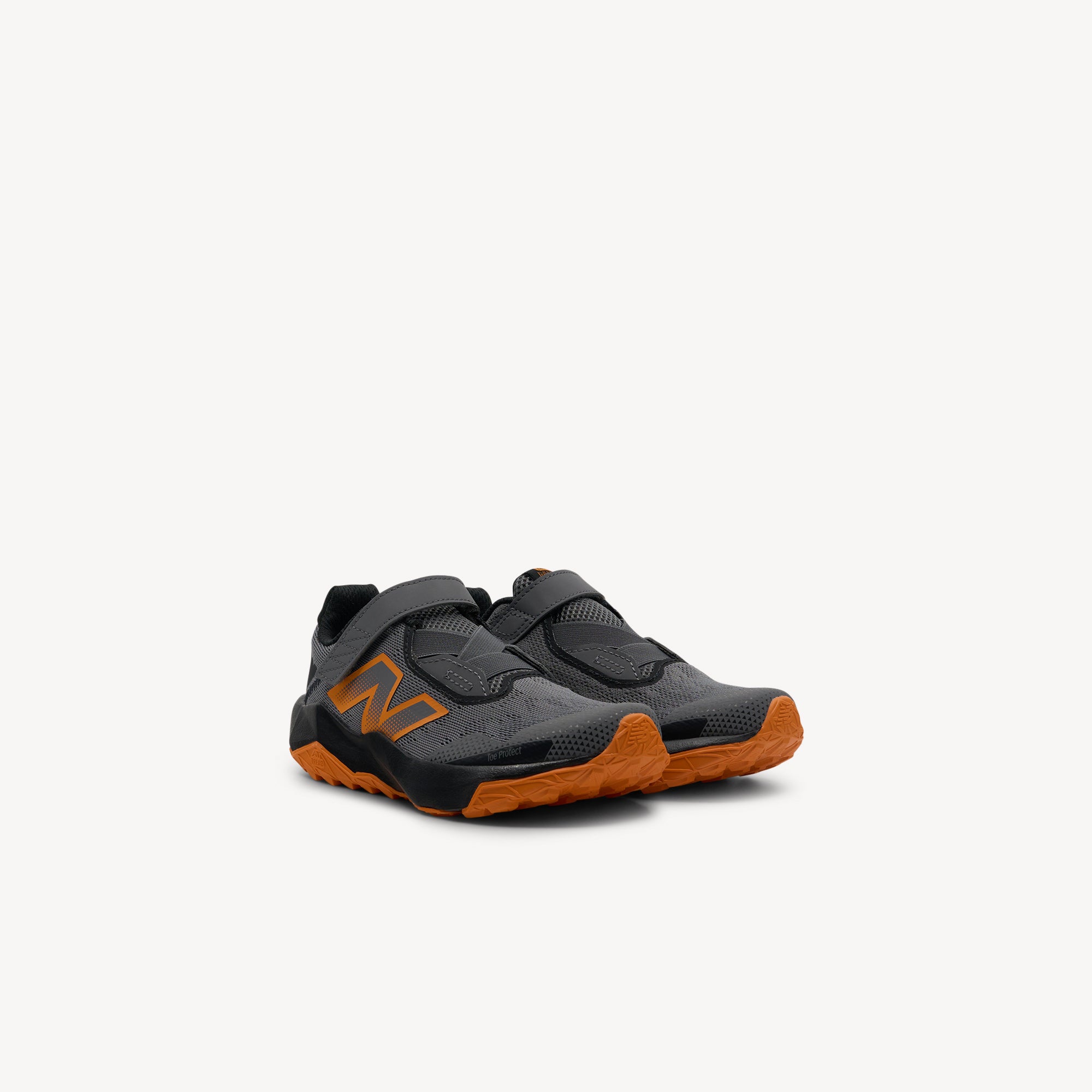 Side view of New Balance Nitrel v6 Hot Mango PS Kids features vibrant Hot Mango styling, plush DynaSoft midsole and AT Tread traction for energetic kids. Shop now at Profeet Footwear.