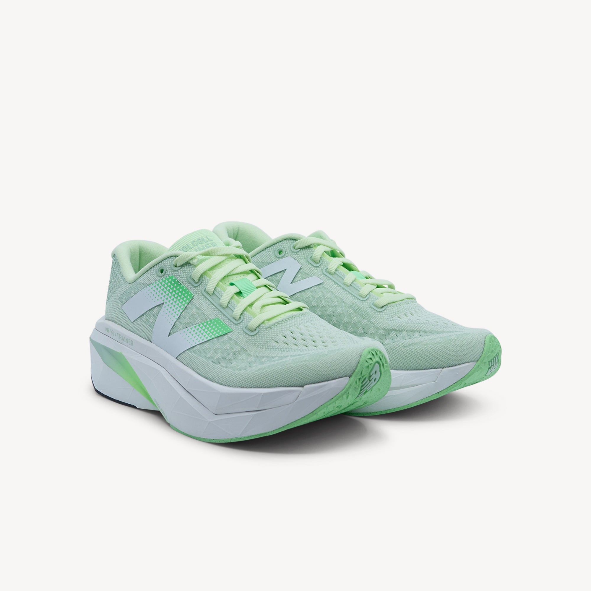Side view of New Balance FuelCell SuperComp Trainer v3 Melon Water Womens features ultra-responsive FuelCell PEBA midsole, carbon fibre plate & Energy Arc system for smoother transitions.