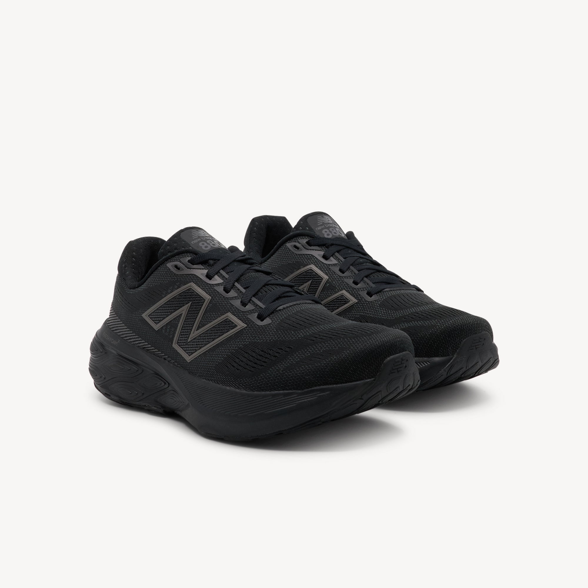 Side view of New Balance Fresh Foam X 880v15 Triple Black Womens features high-comfort Fresh Foam X cushioning, structured mesh upper and 6 mm drop for smooth everyday runs.