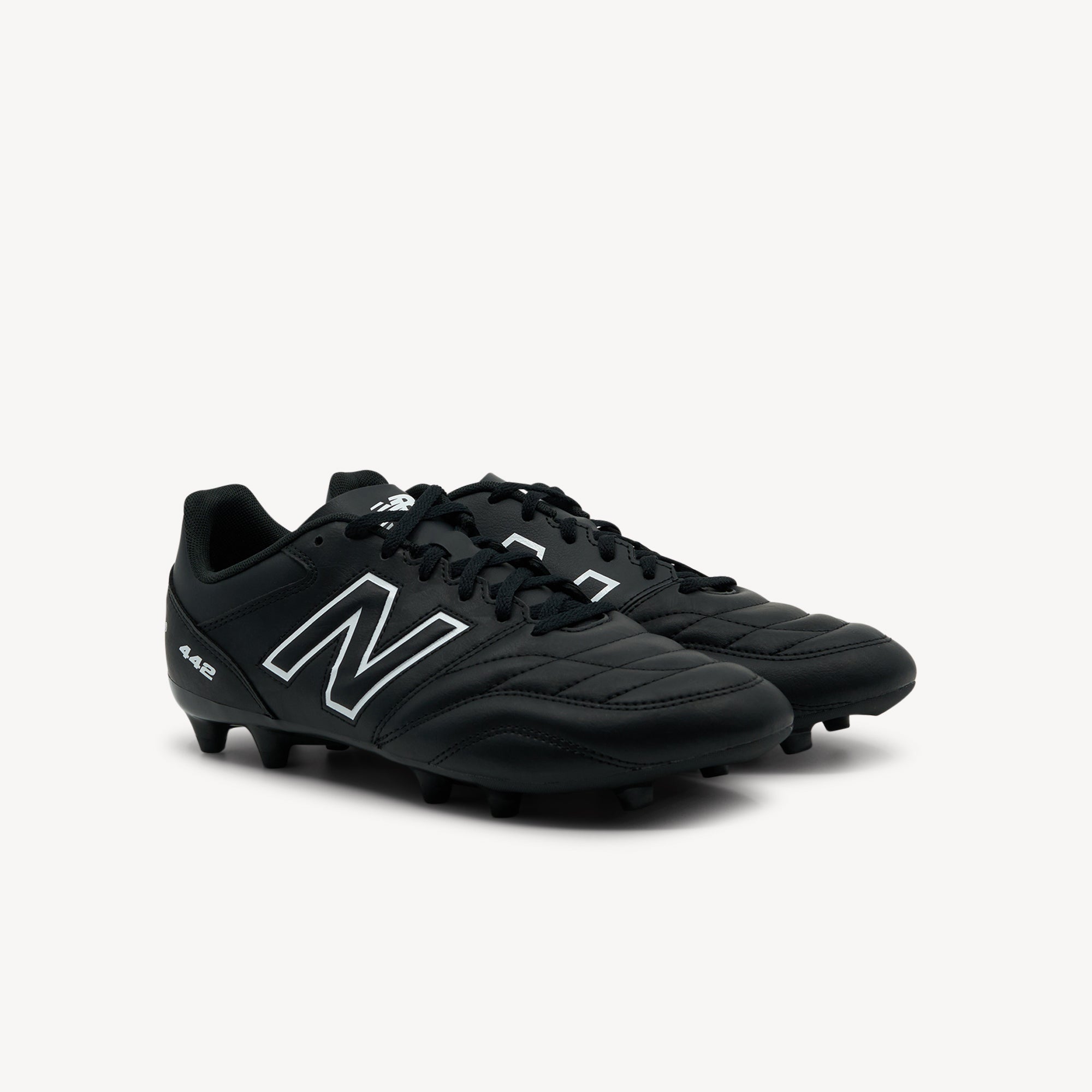 Side view of New Balance 442 Academy features traditional design and reliable traction at Profeet Footwear. Quality football boot for all surfaces. Shop now.