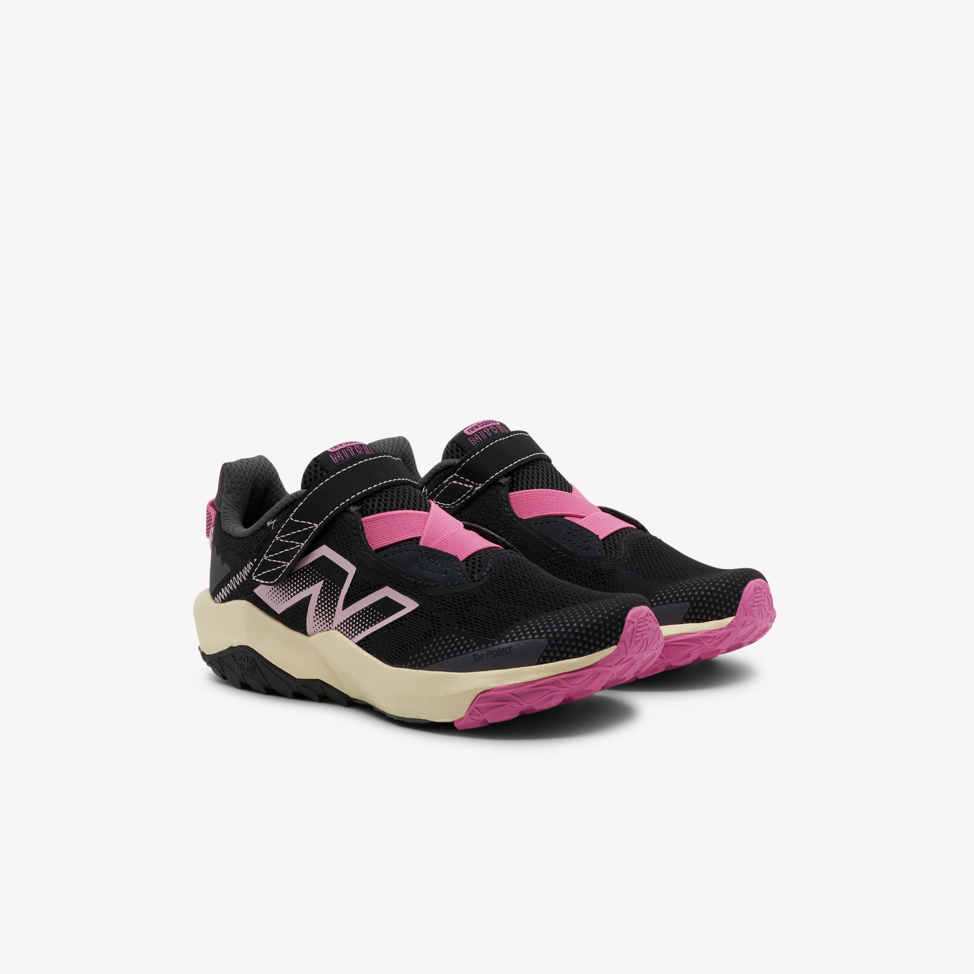 Side view of New Balance Nitrel v6 Black/Pink PS Kids features plush DynaSoft midsole, AT Tread outsole for all‑terrain fun, and breathable mesh upper. Shop now at Profeet Footwear.