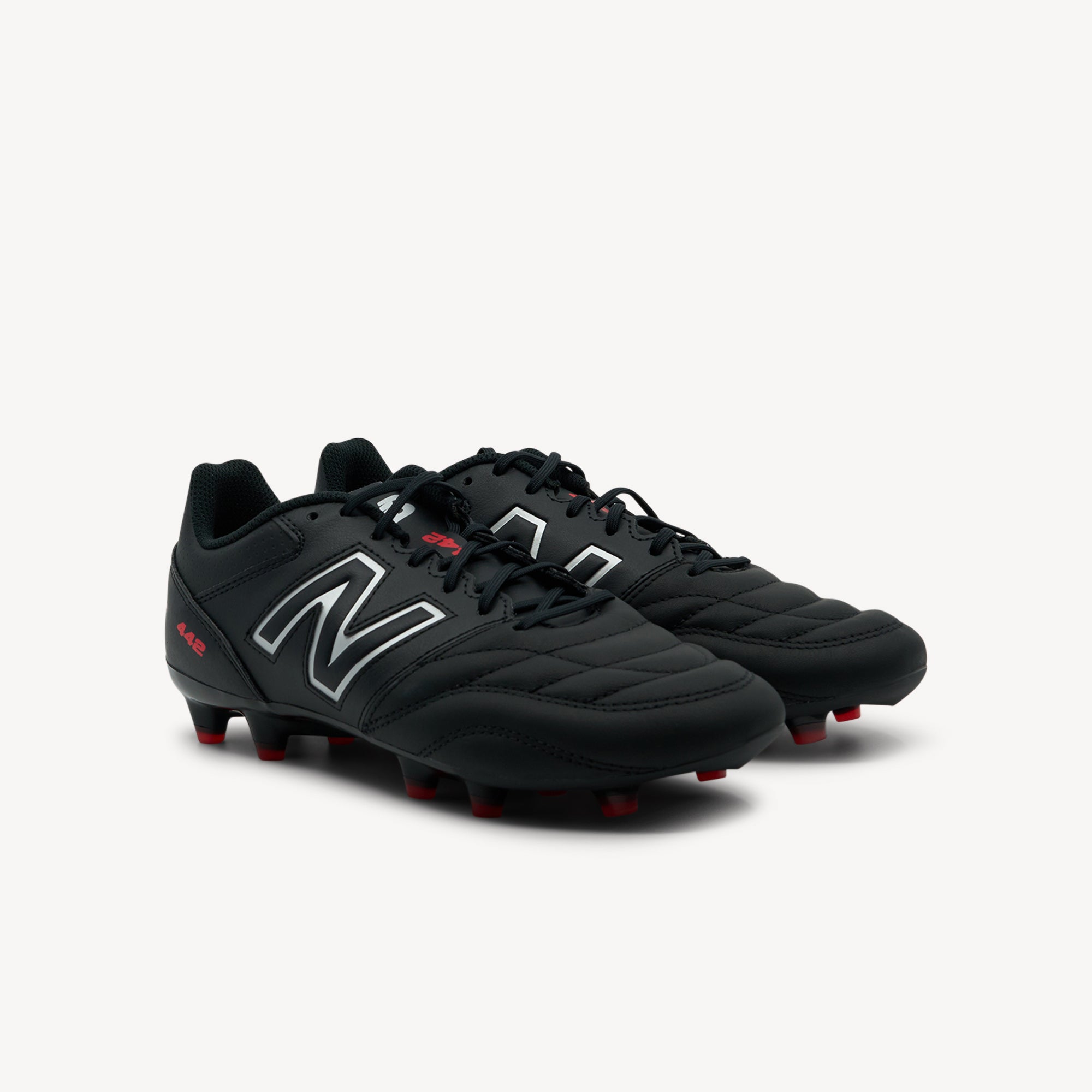 Side view of New Balance 442 Team FG V2 features traditional design and quality materials at Profeet Footwear. Affordable football boot for grassroots players. Shop now.