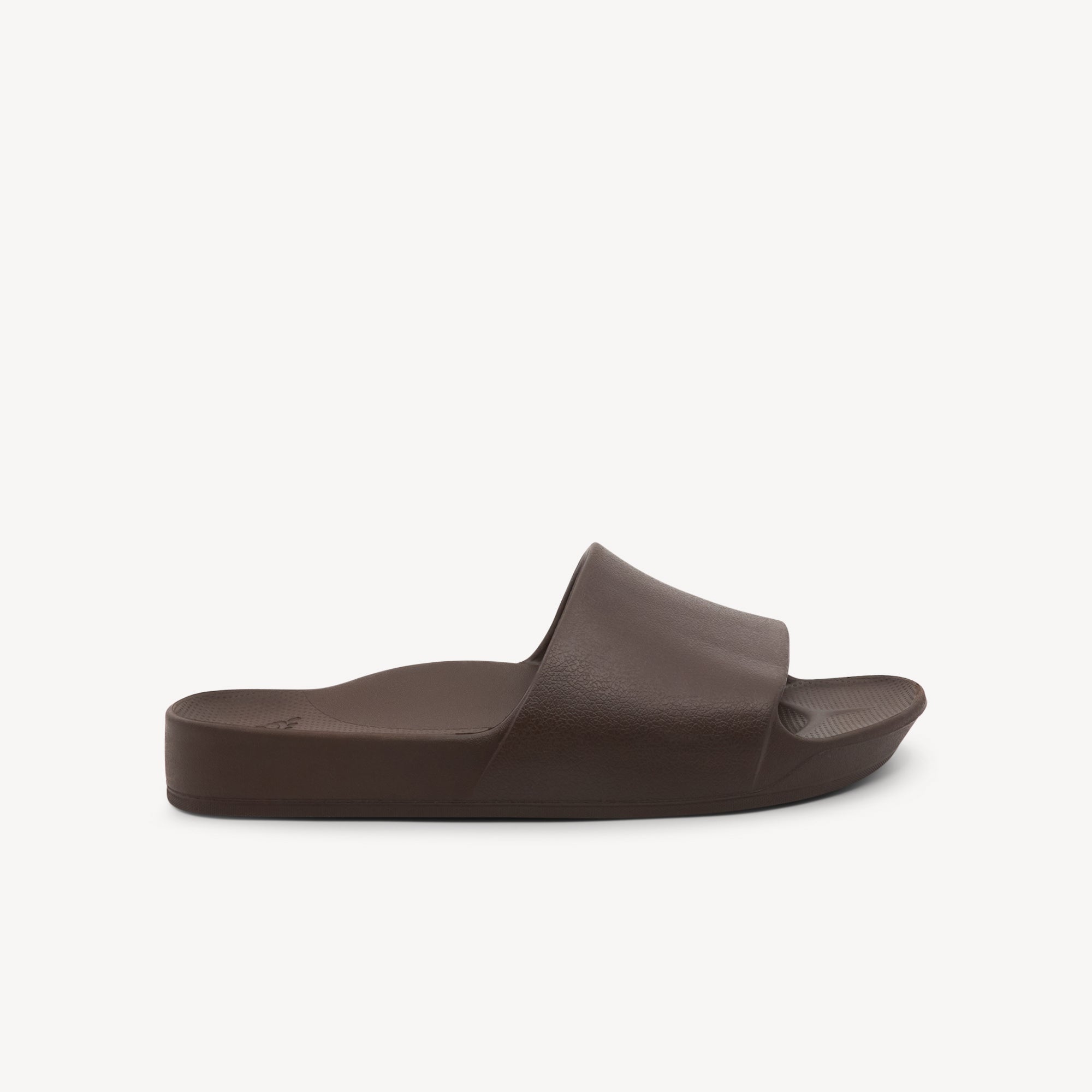 Archies Slides Brown features 2.2cm arch support at Profeet Footwear. Single-mould design for durability and all-day comfort. Shop now.