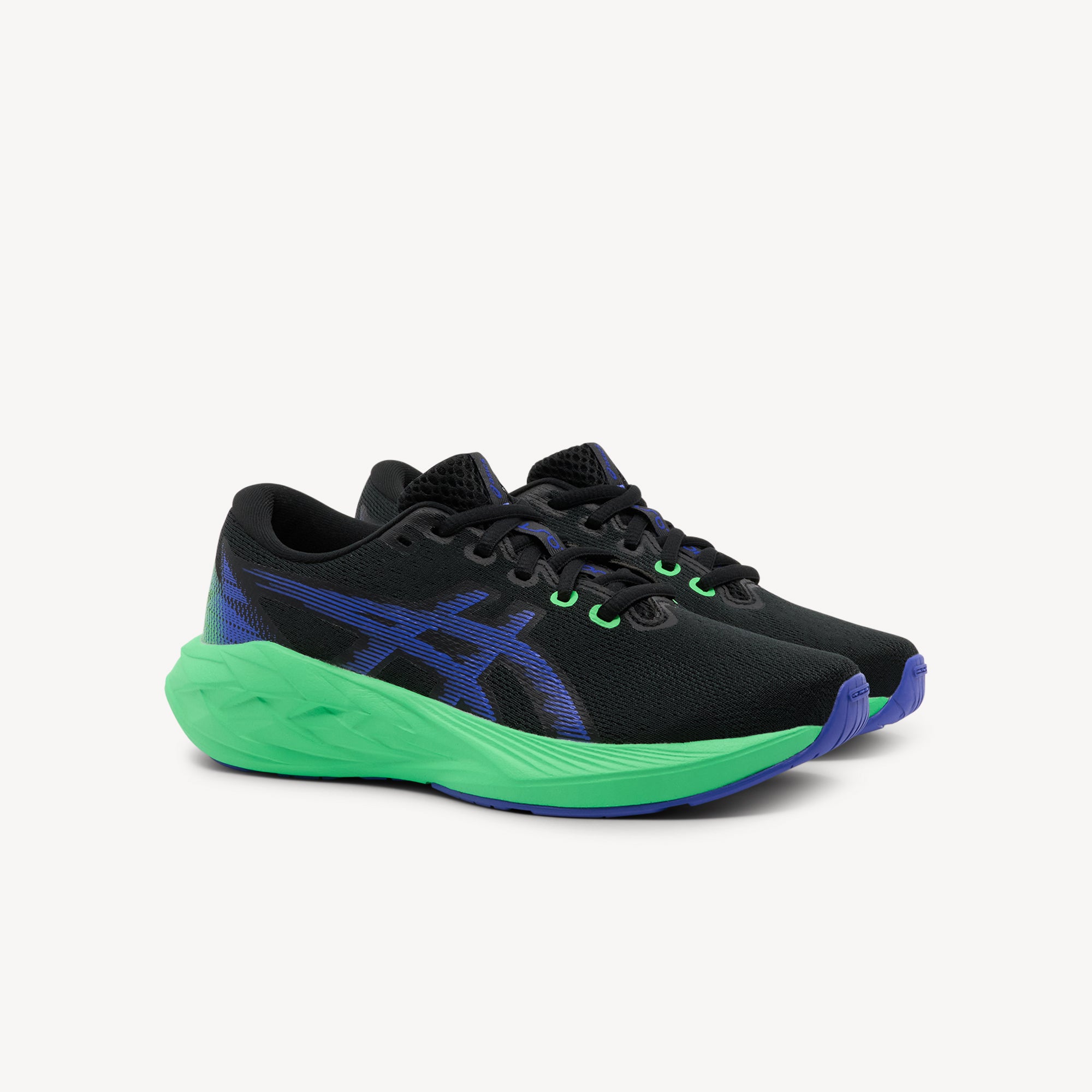 Side view of ASICS NOVABLAST 5 GS features energetic cushioning and responsive bounce at Profeet Footwear. Purpose-built running shoe for kids. Expert-fitted.