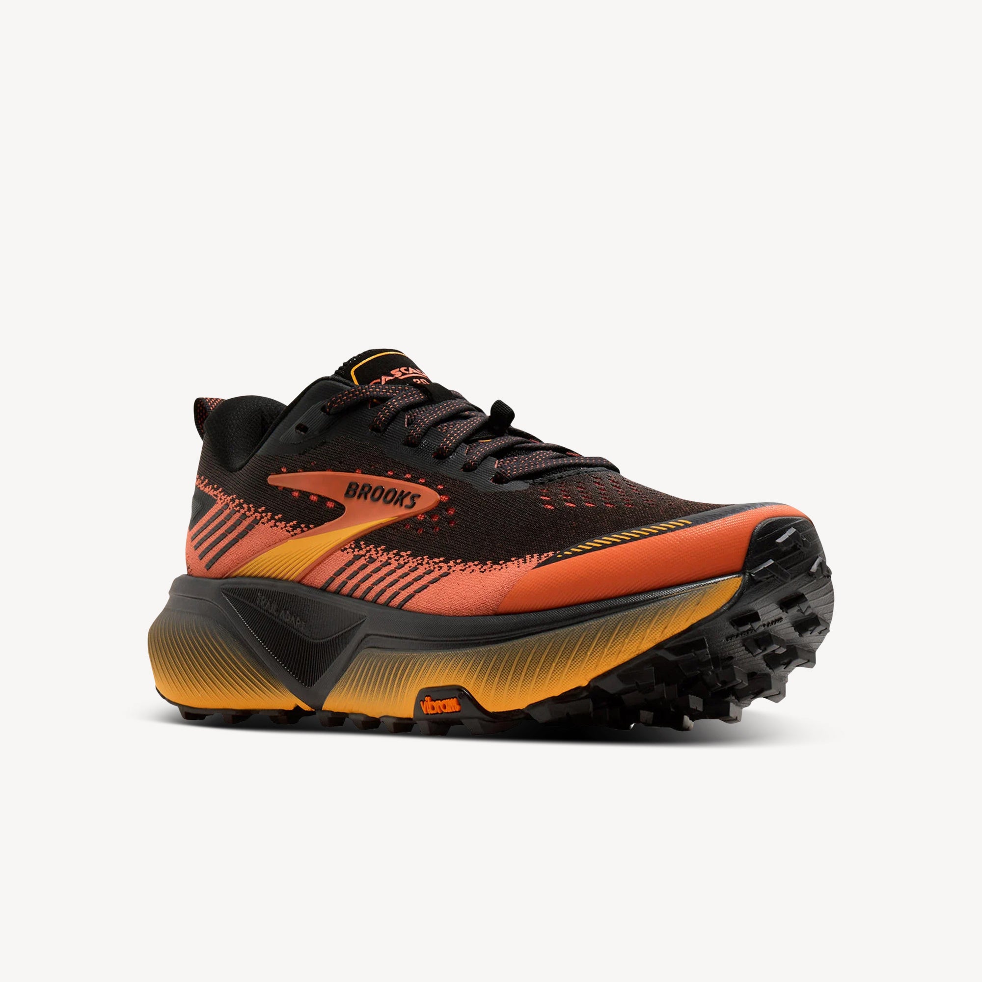 Side view of Brooks Cascadia 20 Black/Tigerlily/Orange men's trail shoe – Vibram Megagrip outsole and DNA FLASH v2 cushioning. Shop now at ProFeet Footwear.