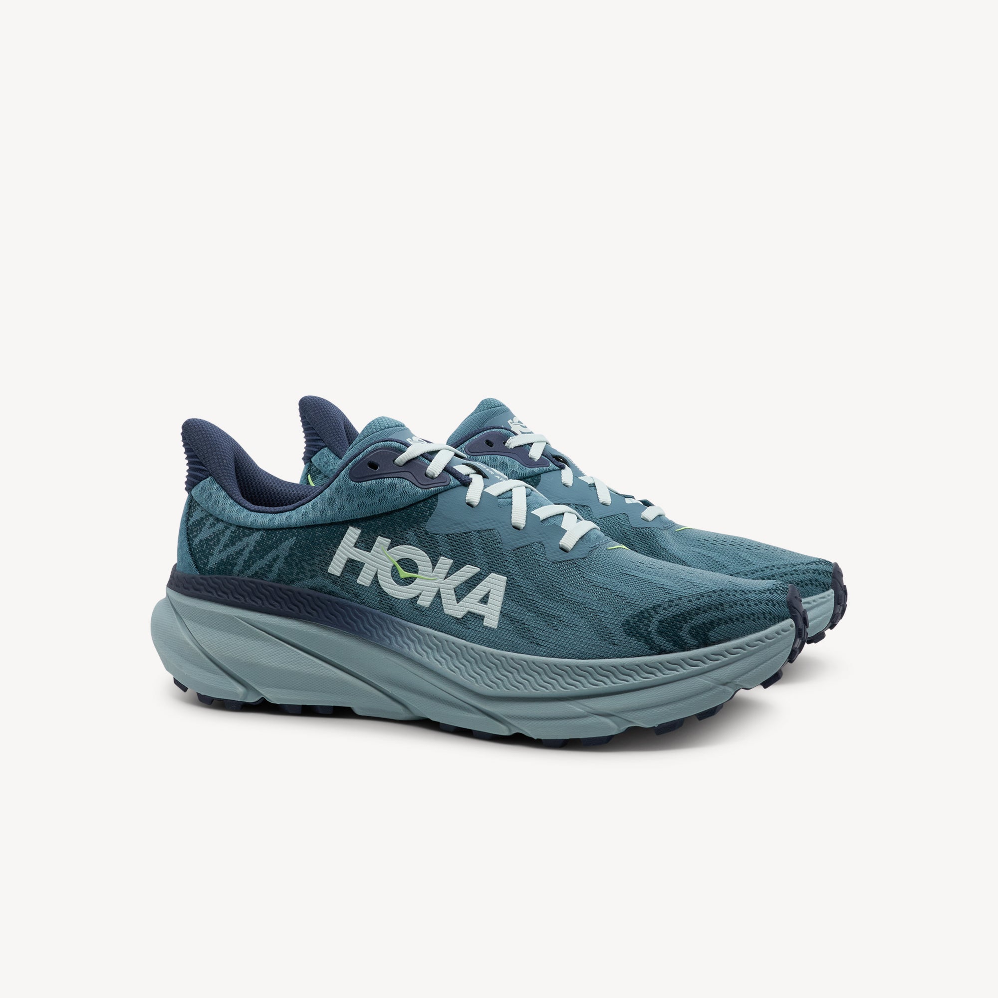 Side view of HOKA Challenger ATR 7 men's showcasing enhanced stack height with compression-molded EVA midsole for all-terrain comfort