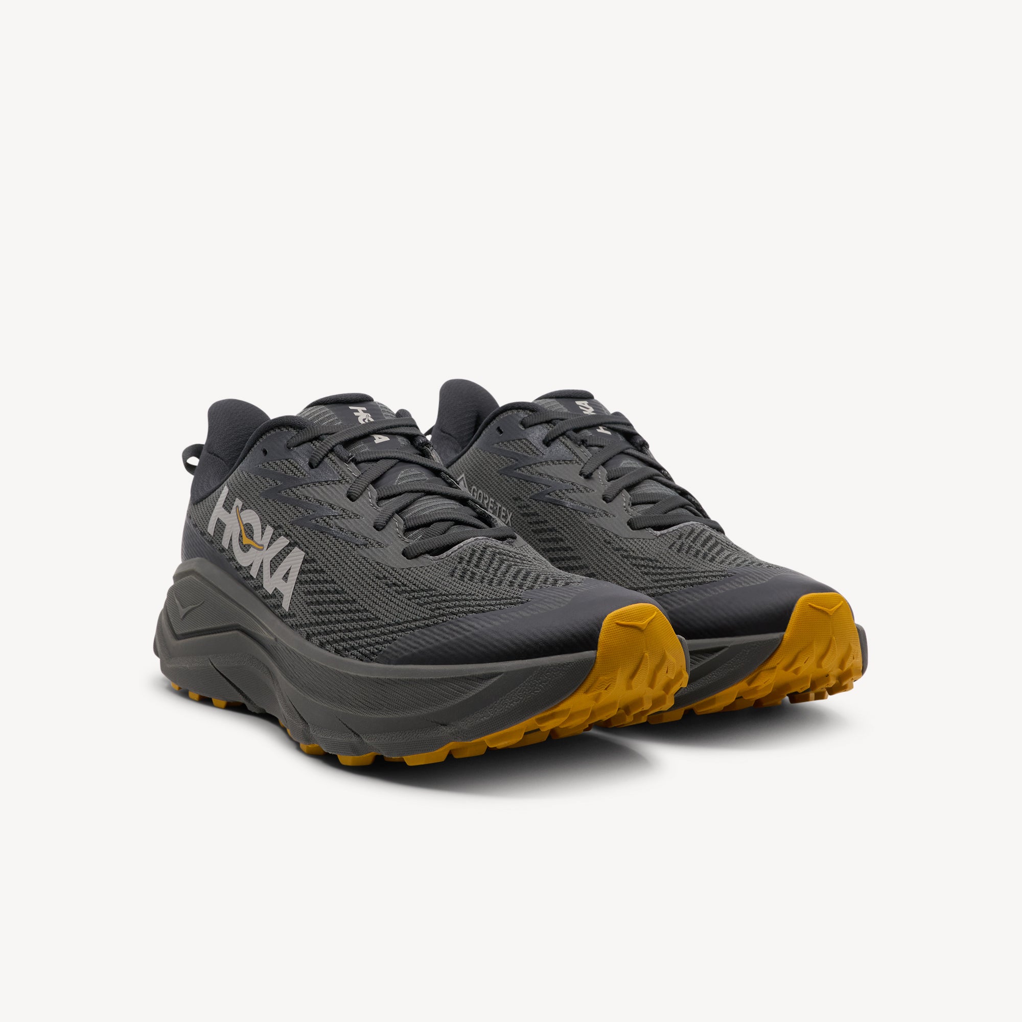 Side view of HOKA CHALLENGER ATR 8 GTX features waterproof protection and all-terrain performance at Profeet Footwear. Purpose-built trail running shoe. Expert-fitted.