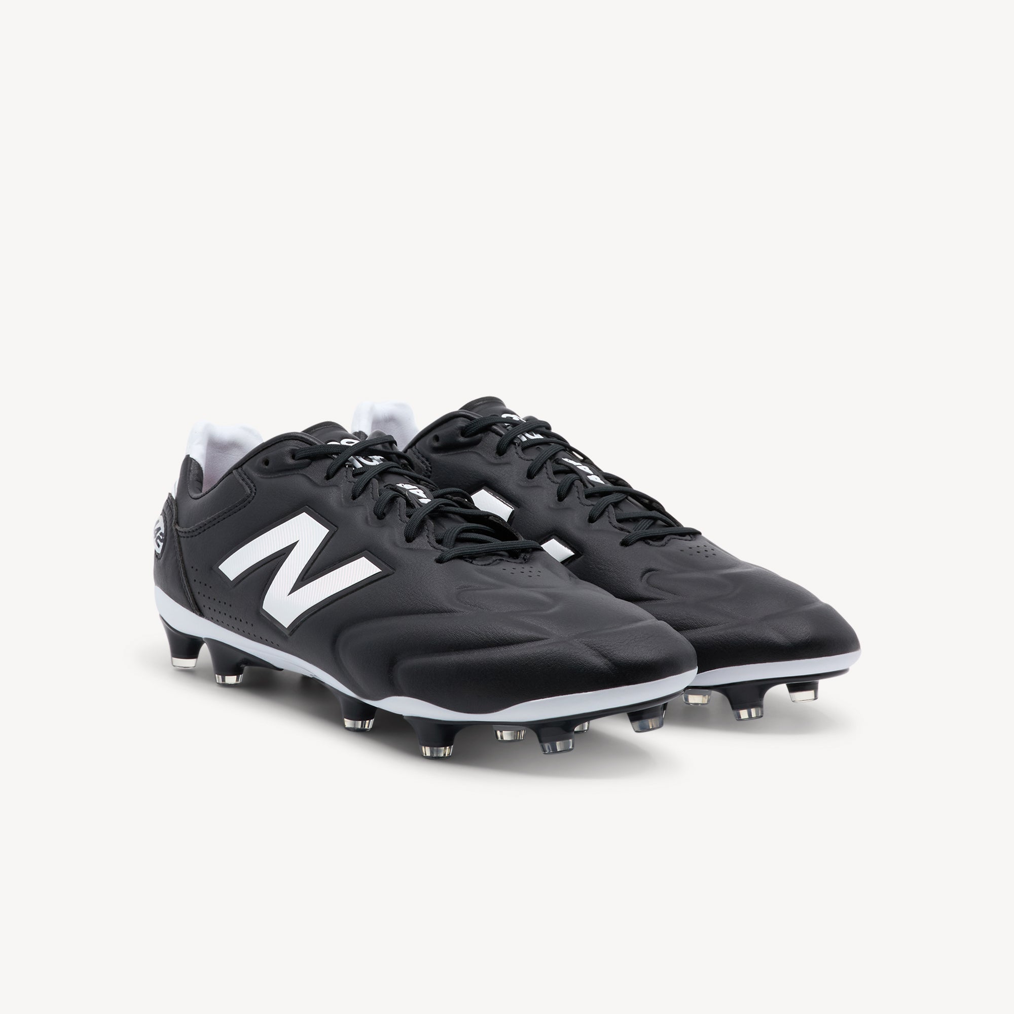 Side view of NEW BALANCE 442 ELITE V3 FG features exceptional touch and elite control at Profeet Footwear. Purpose-built football boot for men. Expert-fitted.