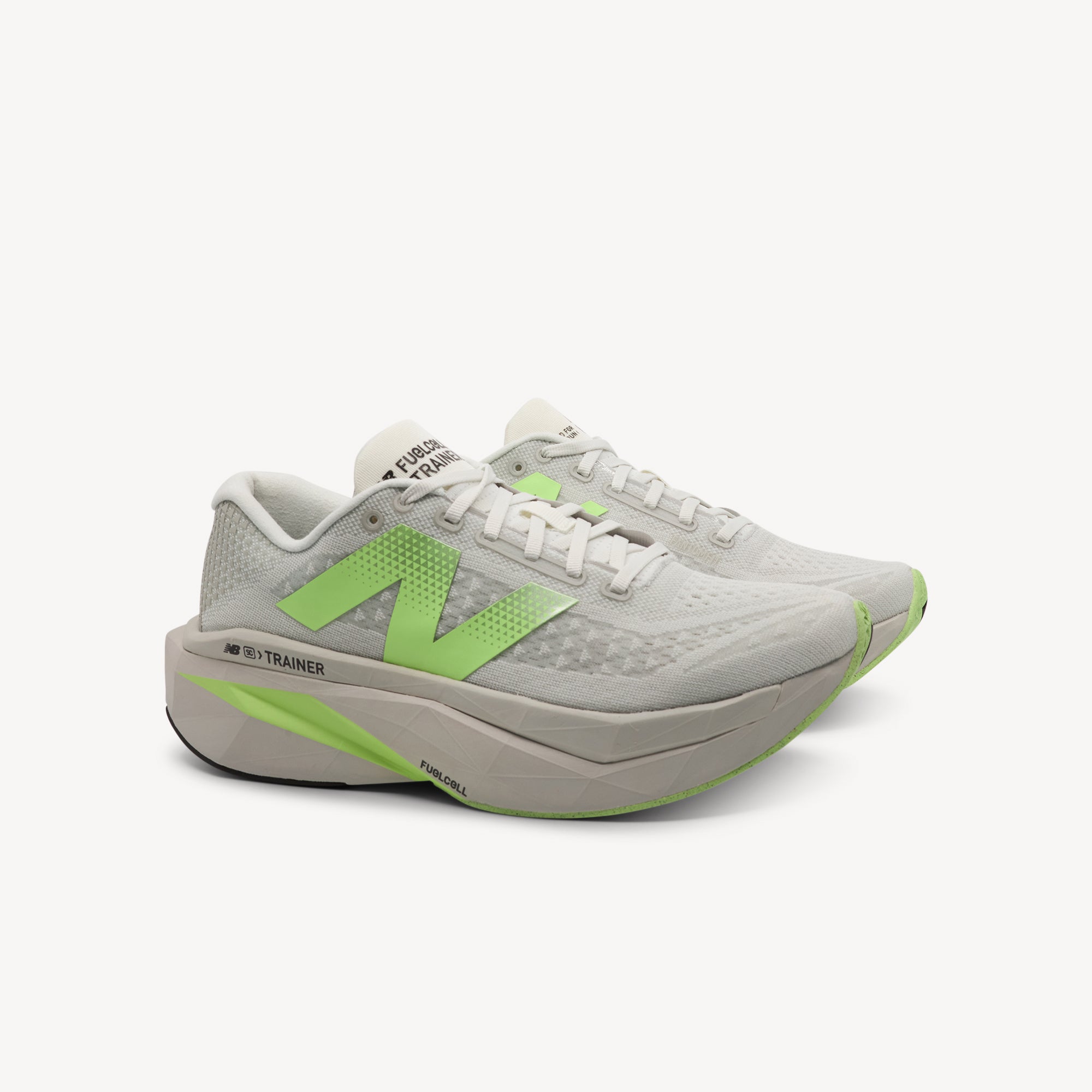 Side view of New Balance SuperComp Trainer v3 features Energy Arc carbon plate at Profeet Footwear. Highly cushioned trainer for bouncy, fast training runs. Shop now.