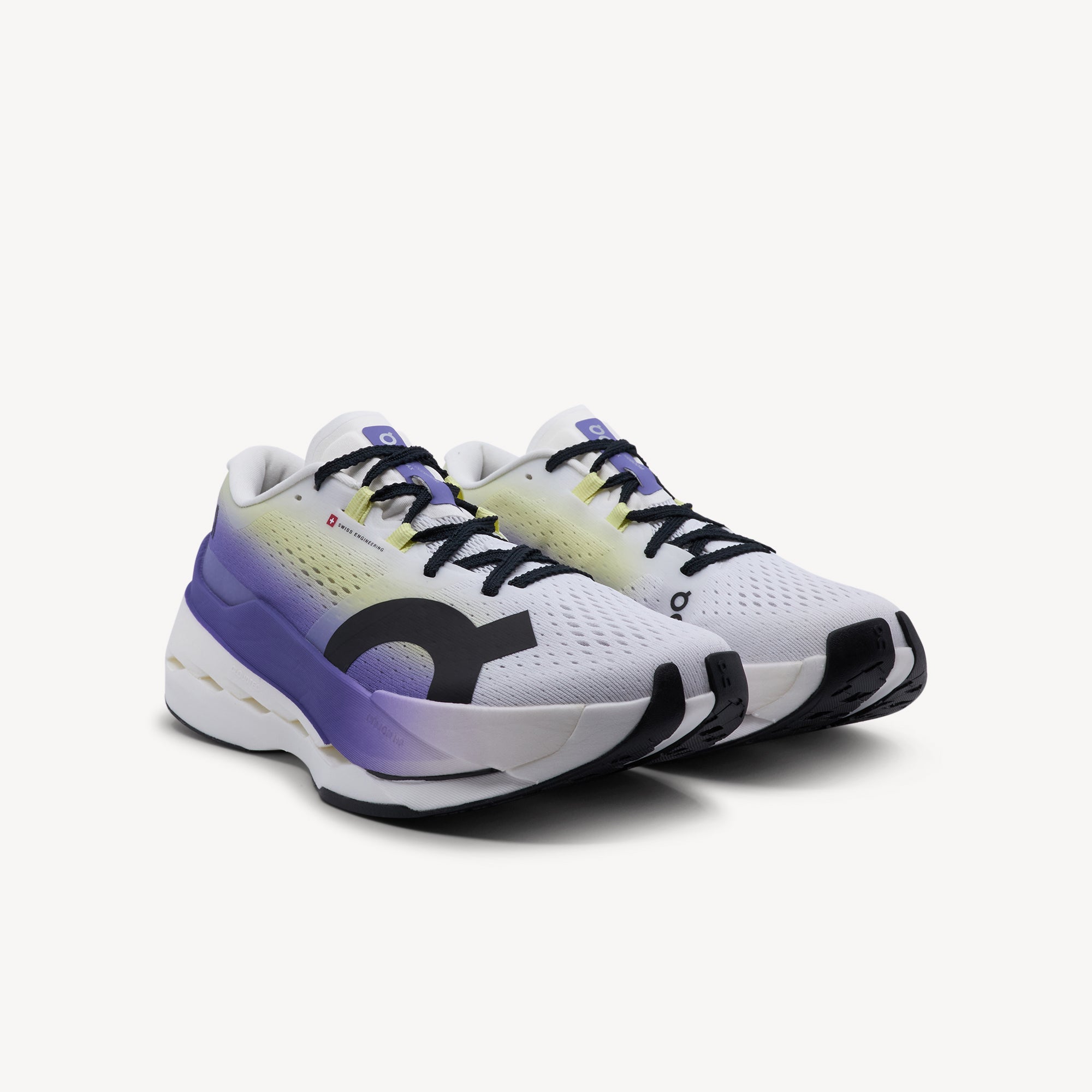 Side view of ON CLOUDBOOM MAX features explosive energy return and elite performance at Profeet Footwear. Purpose-built racing shoe for women. Expert-fitted.