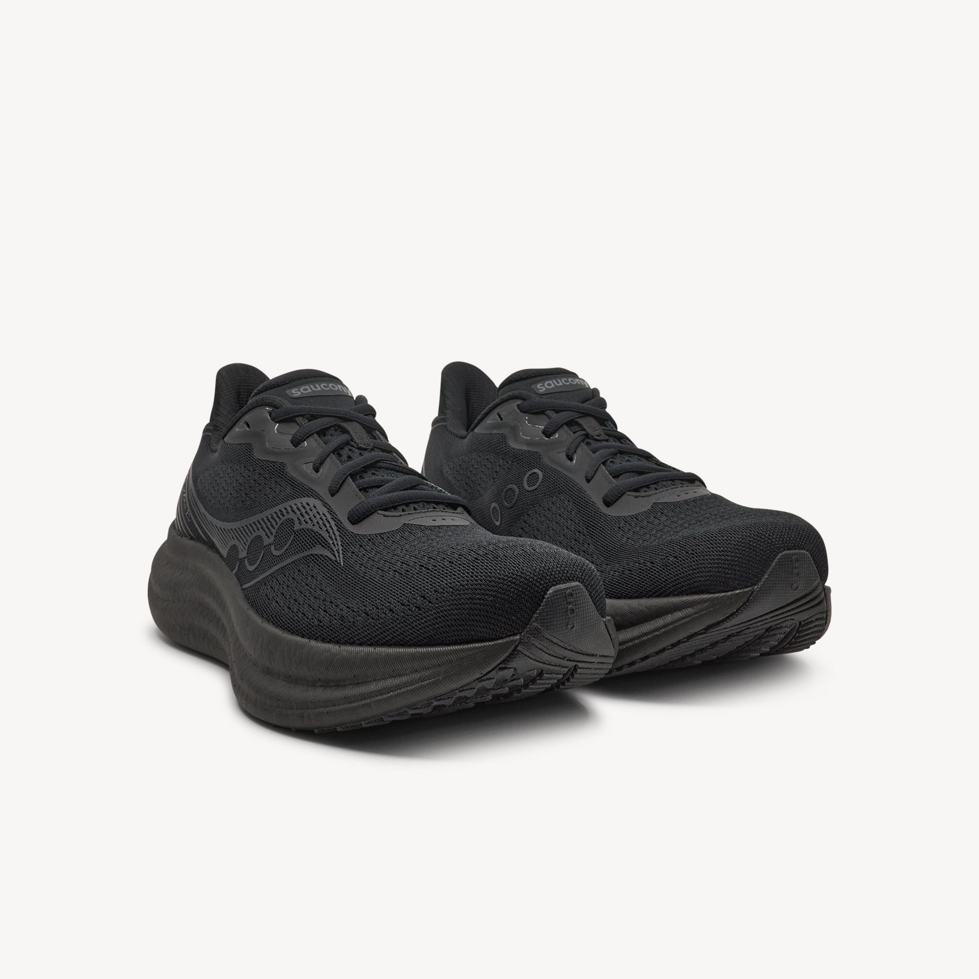 Side view of SAUCONY TRIUMPH 23 features plush comfortable ride and responsive performance at Profeet Footwear. Maximum cushioned running shoe for men. Expert-fitted.
